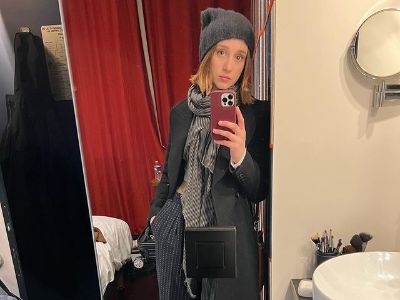 Taissa Farmiga is taking a selfie in front of a mirror.